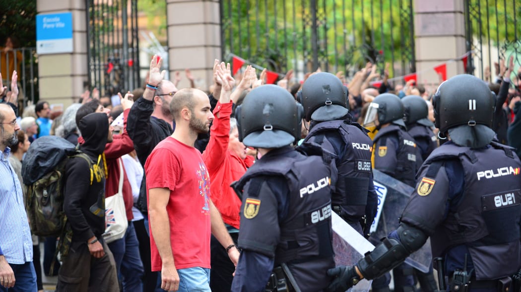 People have begun to vote on the referendum of Catalonia when state and riot police intervened brutally to end the vote and take away the urns from the voters. Barcelona. Spain.