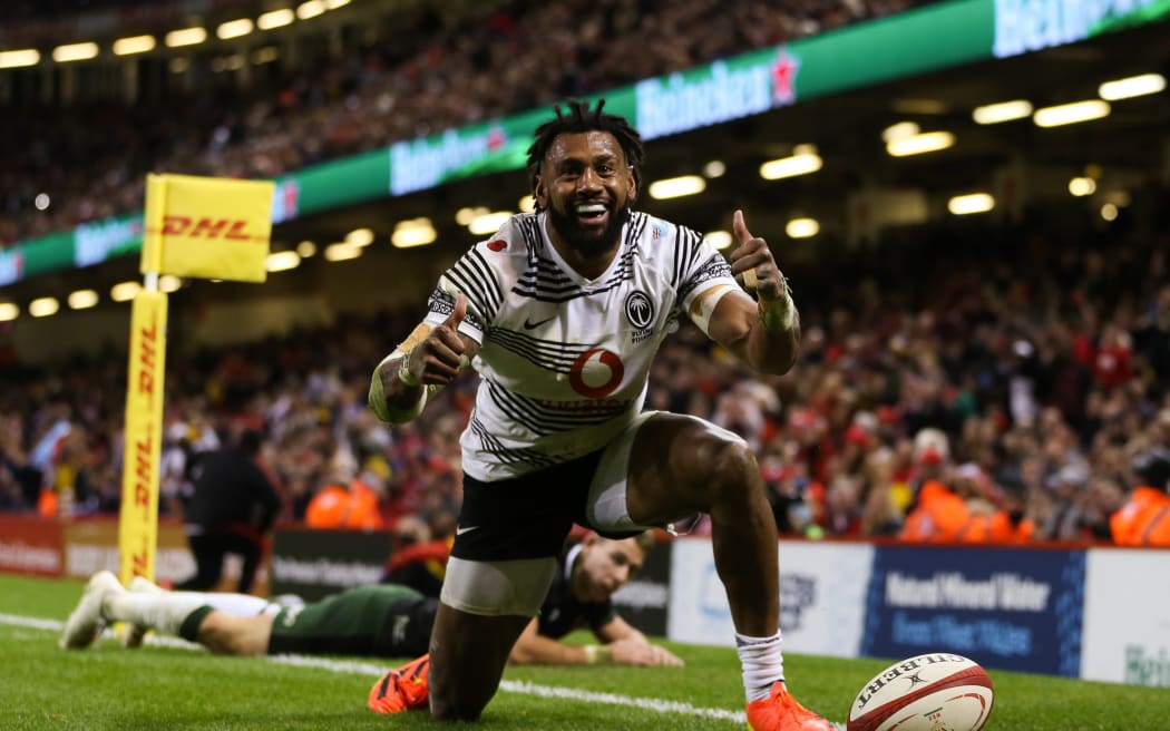 Waisea Nayacalevu of Fiji celebrates after he dives in to score a try against Wales