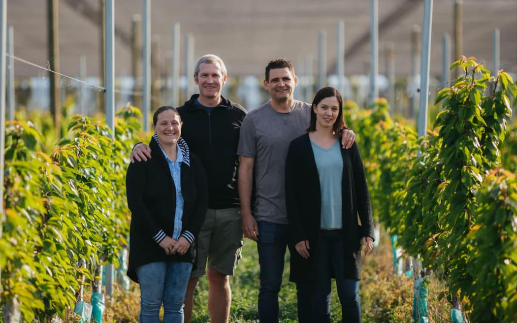 Rachel White, Euan White, Mike Casey and Rebecca Casey at their Forest Lodge Orchard.