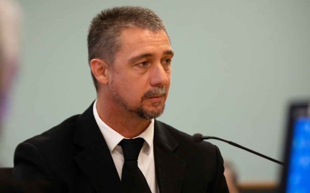 Detective Sergeant Ewan Settle gives evidence at the trial of the man accused of murdering British backpacker Grace Millane.