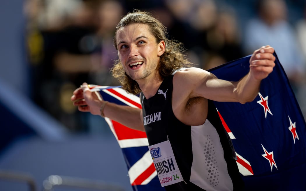 New Zealand’s Geordie Beamish celebrates winning gold in the 1500m at the World Indoor Athletics Championships, 2024, Glasgow