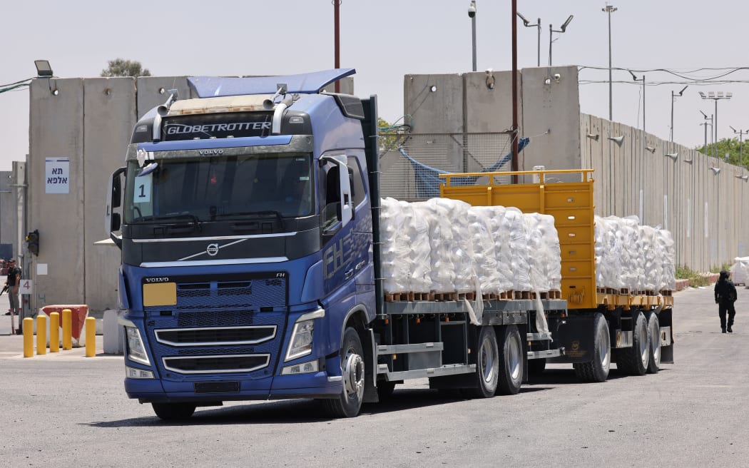 A truck carrying humanitarian aid for the Gaza Strip drives at the Kerem Shalom (Karm Abu Salem) border crossing between southern Israel and Gaza, on 30 May 2024.