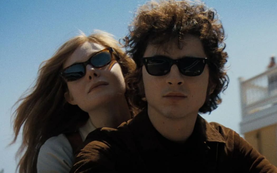 Timothee Chalamet and Elle Fanning play Bob Dylan and girlfriend Sylvie Russo in A Complete Unknown.