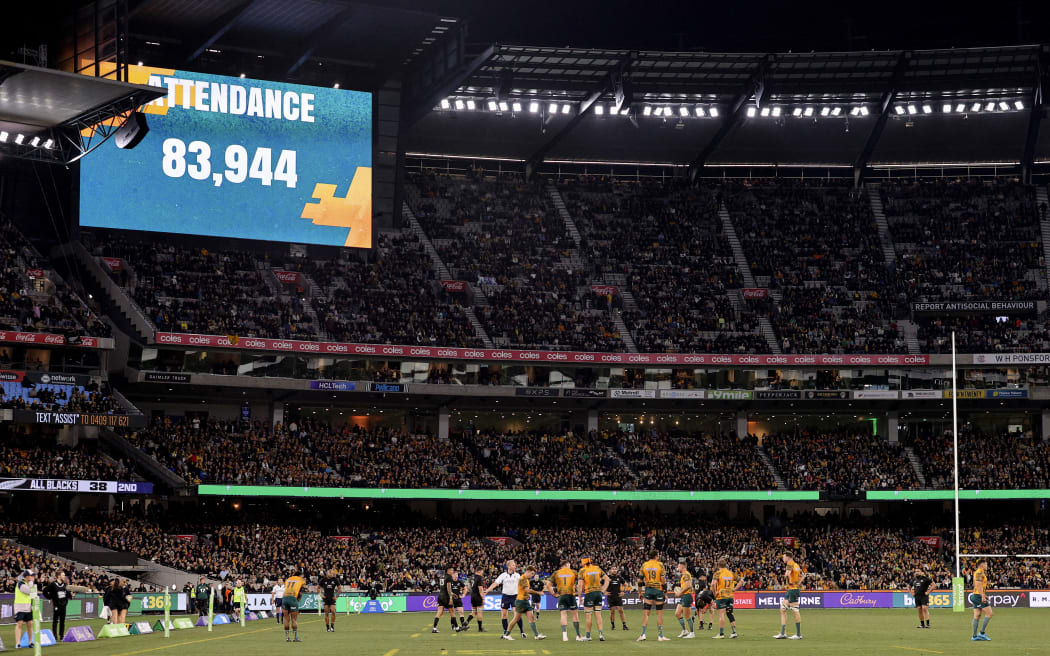The official attendance is displayed on the big screen during the Rugby Championship and 2023 Bledisloe Cup match between Australia and New Zealand at Melbourne Cricket Ground in Melbourne on July 29, 2023. (Photo by Martin KEEP / AFP) / -- IMAGE RESTRICTED TO EDITORIAL USE - STRICTLY NO COMMERCIAL USE --