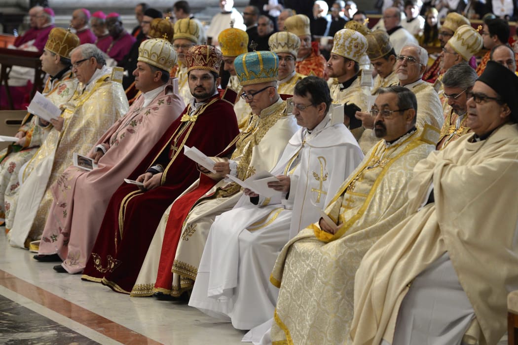 Clergymen attend an Armenian-Rite Mass at St Peter's basilica in Vatican, marking 100 years since the mass killings .
