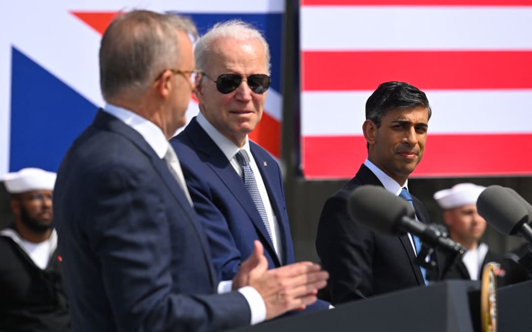 US President Joe Biden (C), British Prime Minister Rishi Sunak (R) and Australian Prime Minister Anthony Albanese (L) hold a press conference during the AUKUS summit on March 13, 2023, at Naval Base Point Loma in San Diego California. AUKUS is a trilateral security pact announced on September 15, 2021, for the Indo-Pacific region. (Photo by Jim WATSON / AFP)