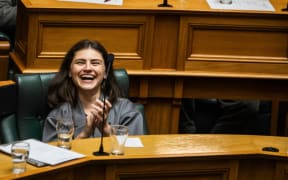 Chloe Swarbrick during James Shaw's valedictory speech