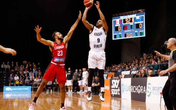 Corey Webster shoots for three points.