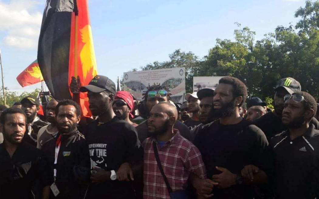 Security guards man a blockade outside the Highlander Hotel in Mt Hagen, Papua New Guinea, on Friday.