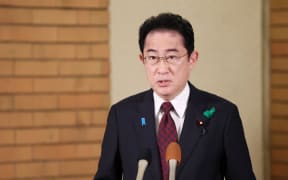 Japanese Prime Minister Fumio Kishida speaks to media about the explosion just before his speech on April 15th at the prime minister’s residence in Tokyo on April 16, 2023. Wakayama prefectural police restrained a man who is believed to have thrown explosives at the site where Japan’s Prime Minister Fumio Kishida was scheduled to give a speech for by-election of Lower House. The man, 24-year-old Ryuji Kimura, was arrested at the scene on suspicion of forcible obstruction of business on the same day.( The Yomiuri Shimbun ) (Photo by Ryoichiro Kida / Yomiuri / The Yomiuri Shimbun via AFP)