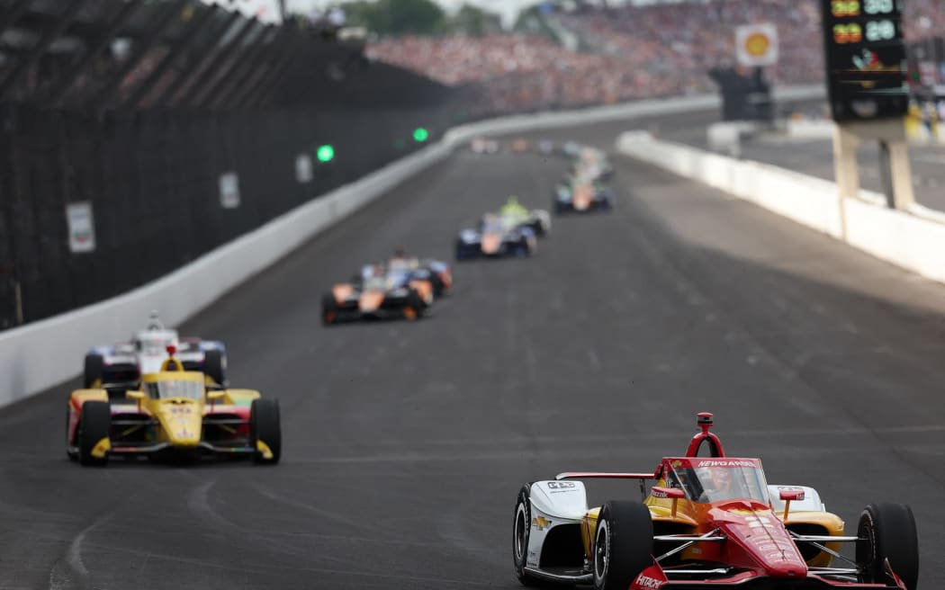 Josef Newgarden of Team Penske, leads a pack of cars during the 108th Running of the Indianapolis 500 at Indianapolis Motor Speedway on May 26, 2024 in Indianapolis, Indiana.