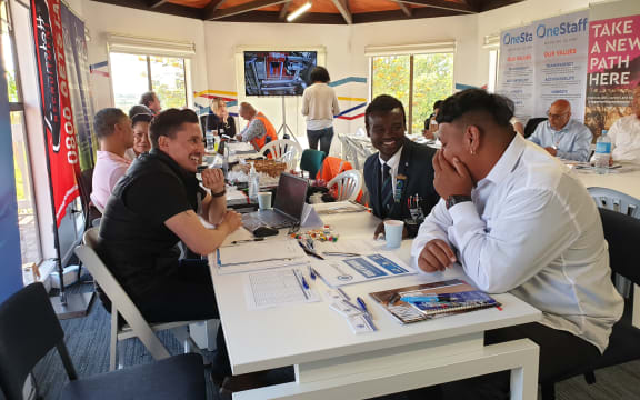 	Māngere College graduate Younis Ahamt Abdallah (in dark blue suit).