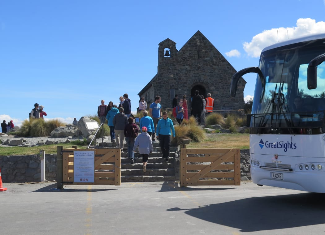 Tourists visit at the Church of the Good Shepherd in Tekapō.