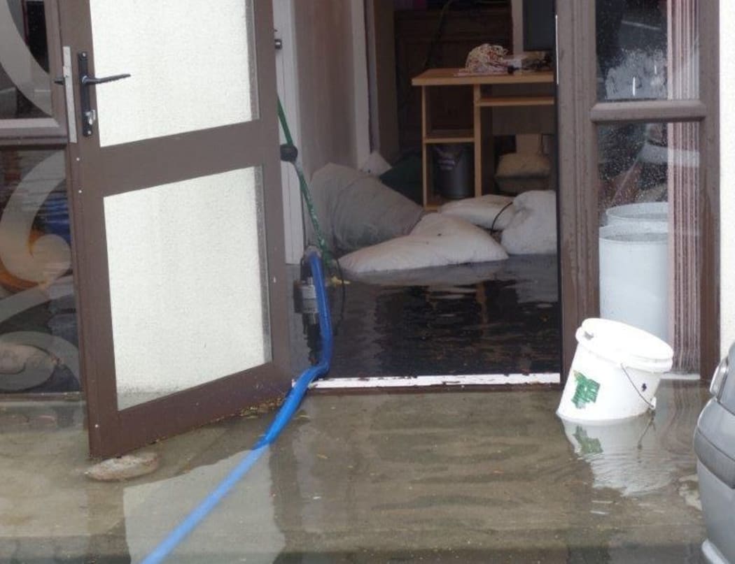 Bedding was used as sandbags to try to to stop the floodwater.