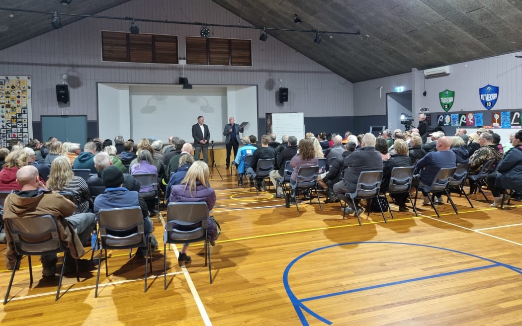 A community meeting with residents about cyclone and flood-damaged properties placed into risk categories in rural Puketapu on 14 June, 2023.