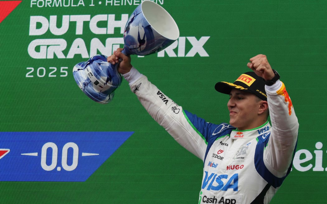 Isack Hadjar of Visa Cash App Racing Bulls F1 Team celebrates his third place finish at the 2025 Dutch Grand Prix.