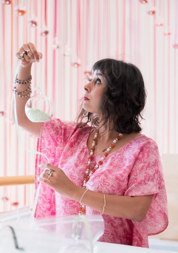 Tiffany Singh installing Indra's Bow in Toi Art, Wellington