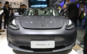Tesla's Model 3 is displayed during China International Import Expo.