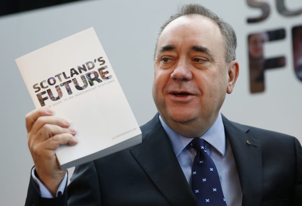 Alex Salmond holds a white paper on independence during its launch in Glasgow last year.