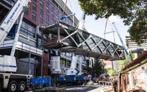 Bridge being craned into position between NZICC Horizon Hotel and SkyCity on 24 October, 2020.
