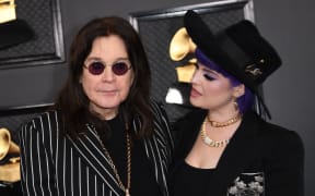 British singer-songwriter Ozzy Osbourne and his daughter Kelly Osbourne arrive for the 62nd Annual Grammy Awards on January 26, 2020, in Los Angeles. (Photo by VALERIE MACON / AFP)