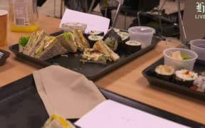 A NZHerald.co.nz livestream of reporters' sandwiches and juice at Auckland Hospital.