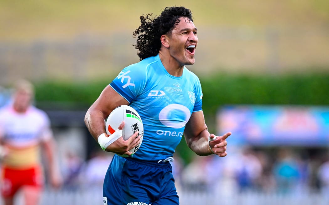 Dallin Watene-Zelezniak on his way to the try line during the Warriors pre-season win over the Dolphins.
