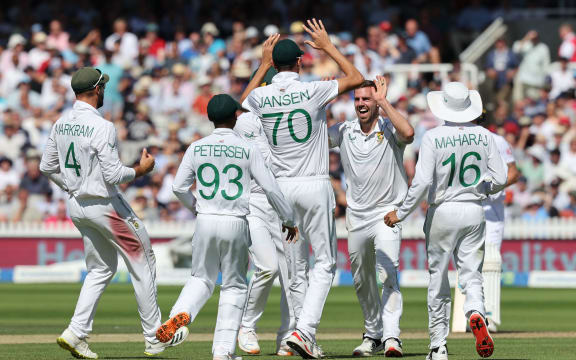 South Africa's Anrich Nortje celebrates with teammates during the 2022 test series with England.
