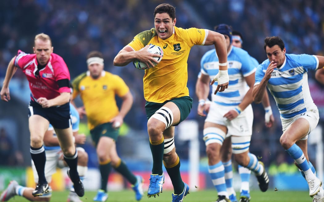 Wallabies lock Rob Simmons runs towards the try line.