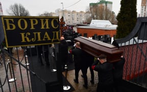 Pallbearers carry the coffin of late Russian opposition leader Alexei Navalny during a funeral ceremony at the Borisovo cemetery in Moscow's district of Maryino on March 1, 2024. (Photo by Olga MALTSEVA / AFP)