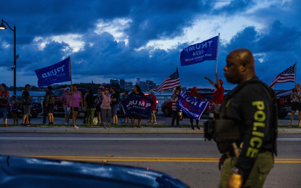 Supporters of former Donald Trump gather outside his Mar-a-Lago property on Palm Beach, Florida, following the events at the Butler rally, on 13 July, 2024.