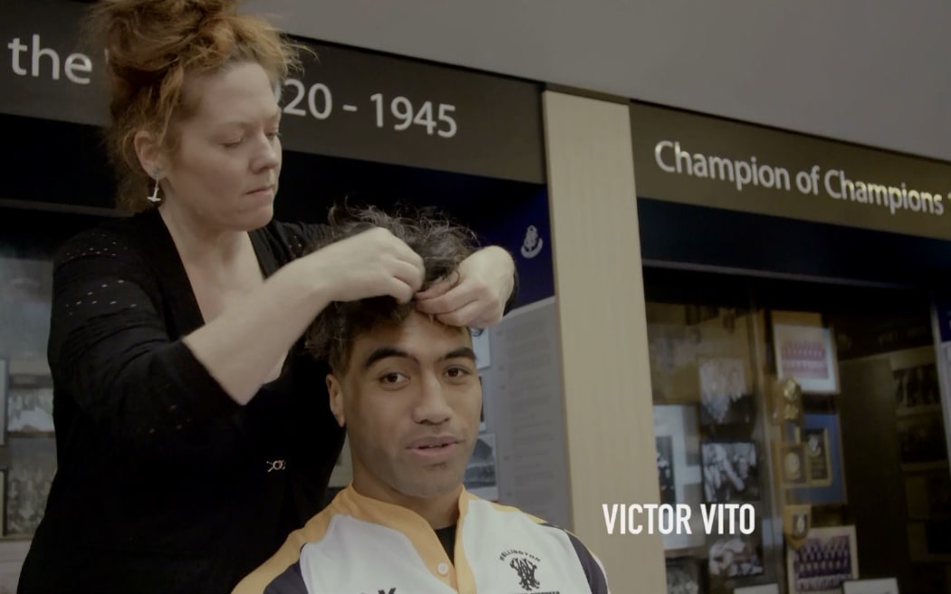 Victor Vito has his disguise applied before the match.