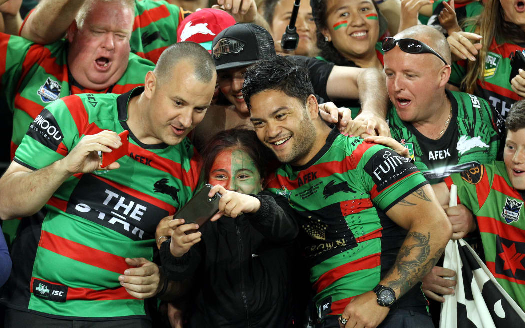 Isaac Luke celebrates with fans at the NRL Grand Final