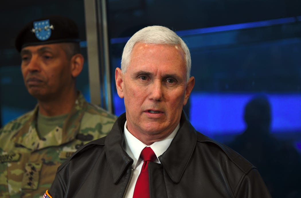 Mike Pence (right) speaks to the media as US General Vincent Brooks, Commander of the United Nations Command, Combined Forces Command and United States Forces Korea looks on.