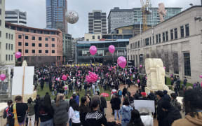 Pink balloons are being handed out by Freedoms NZ at Civic Square.
