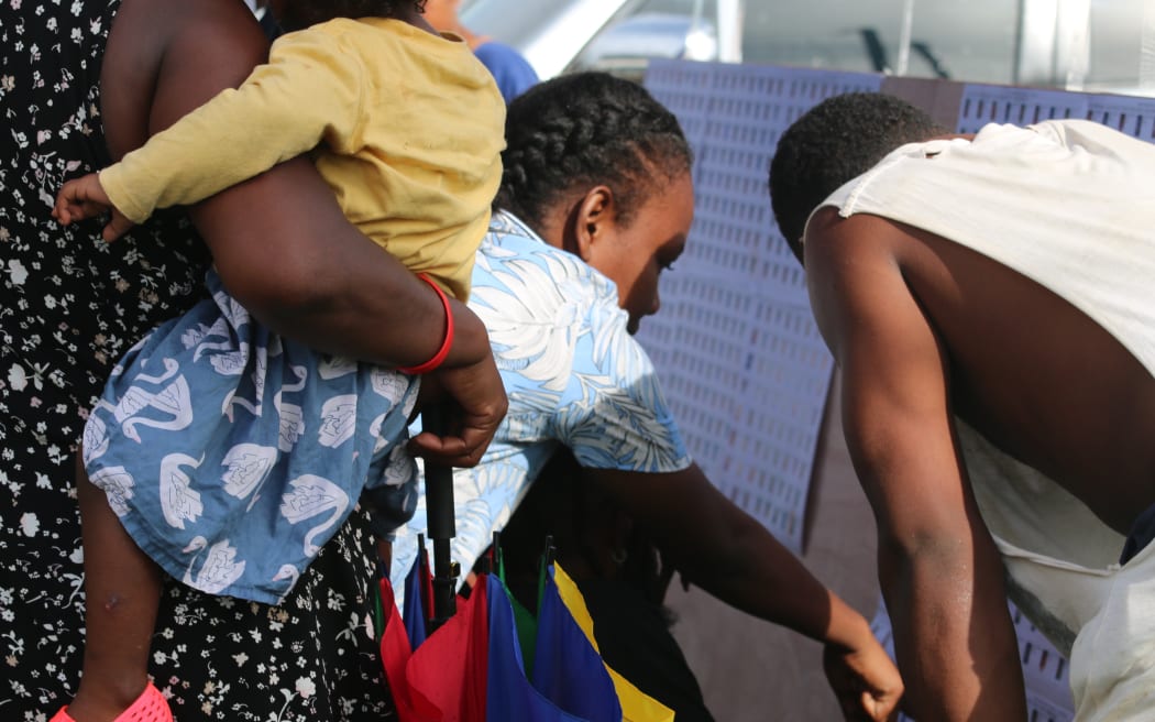 Voters in Solomon Islands check for their names at a polling station in West Honiara. 17 April 2024