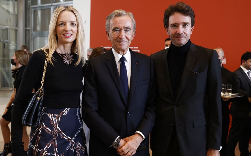 Bernard Arnault (centre) is the head of LVMH luxury group, and the world's richest person.