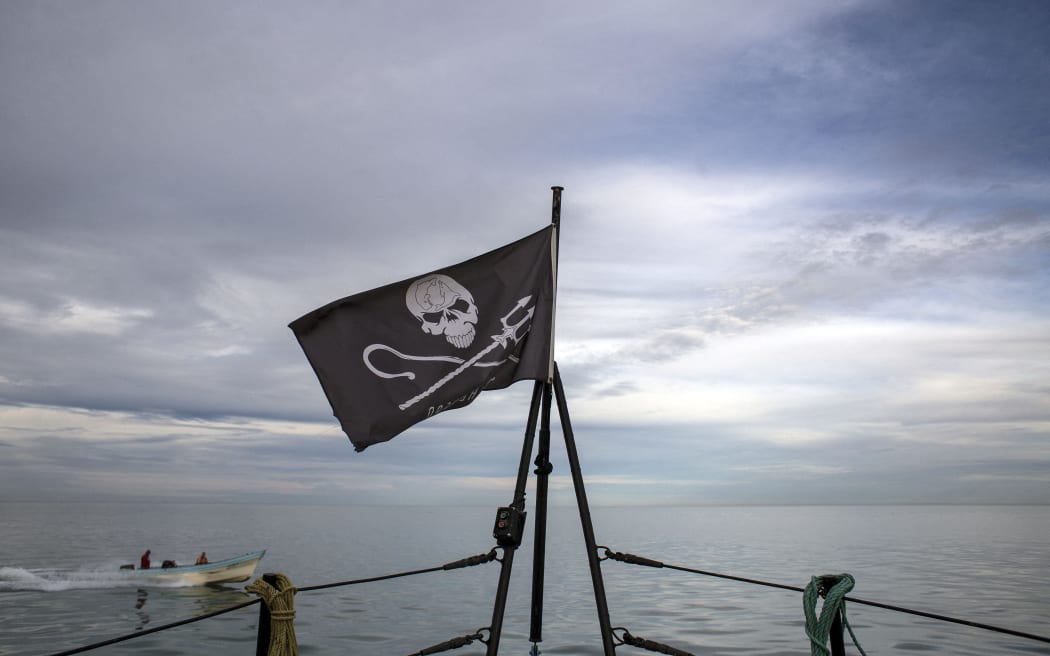 A fishing boat passes by as the M/V John Paul Dejoria navigates near San Felipe bay, in the Gulf of California, Baja California state, northwestern Mexico, on March 7, 2018, as part of the Sea Shepherd Conservation Society's operation "Milagro IV" to save the critically endangered vaquita porpoise.