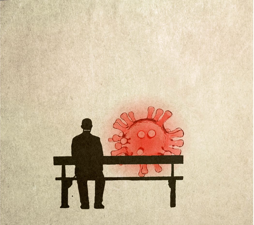 Man sitting on a bench next to Covid particle, illustration. (Photo by FANATIC STUDIO / SCIENCE PHOTO L / FST / Science Photo Library via AFP)