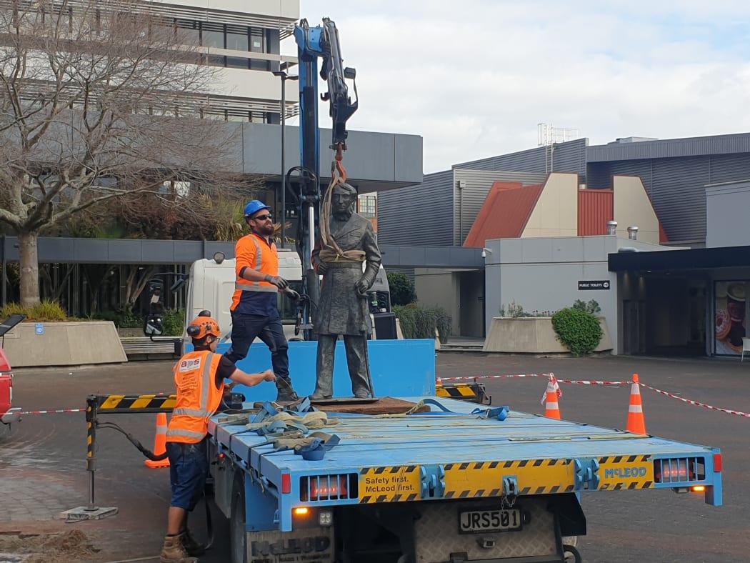 The statue of Captain John Fane Charles Hamilton being removed.