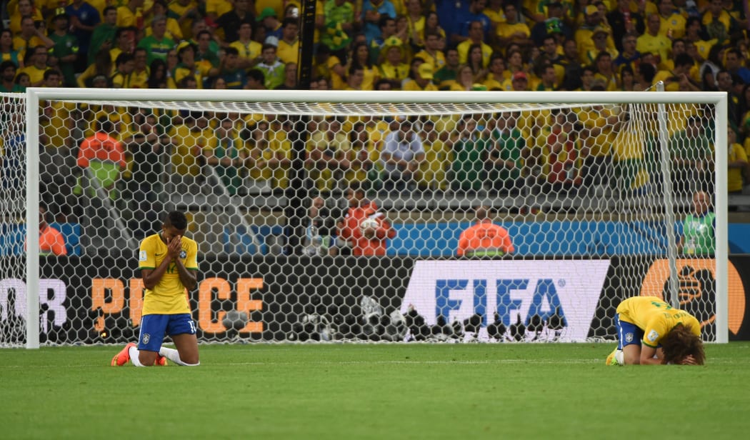Brazil's devastated midfielder Luiz Gustavo, left, and defender David Luiz.