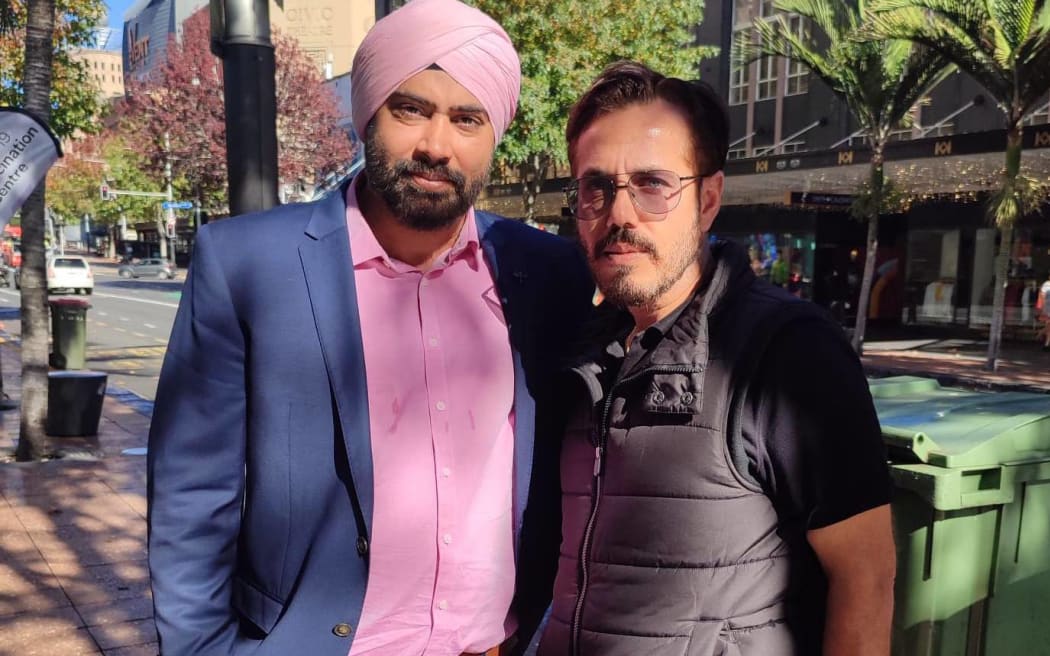 Migrant rights advocate Sunny Sehgal [left], with Sher Singh from the Migrant Rights Network.