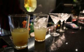 line of drinks in a bar