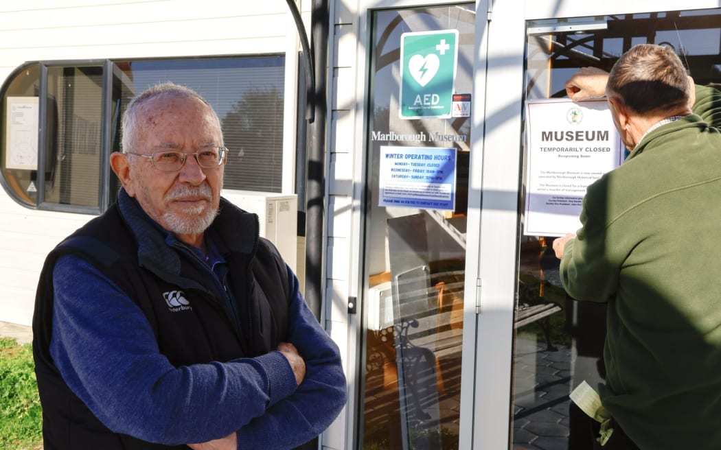Marlborough Historical Society members Paul Davidson, left, and Trevor Jane change the sign at Marlborough Museum on Wednesday.