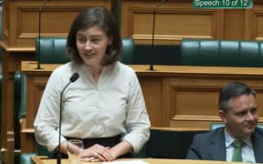 Green MP Chlöe Swarbrick speaking in parliament and responding to heckling with 'okay, Boomer'.