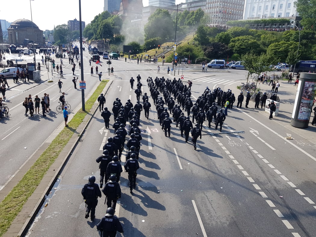Riot police use water cannon on July 7, 2017 in Hamburg, northern Germany, where leaders of the world's top economies gather for a G20 summit.