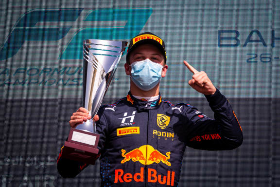 Liam Lawson celebrates after winning his first race in Formula 2 competition.