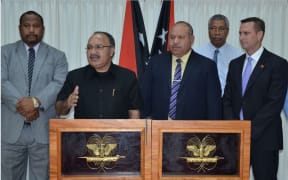 Members of PNG's government, including Energy and Petroleum Minister, Nixon Duban (far left) and Prime Minister Peter O'Neill (talking) with PNG Power figures and ExxonMobil PNG Production Manager Andrew Barry.