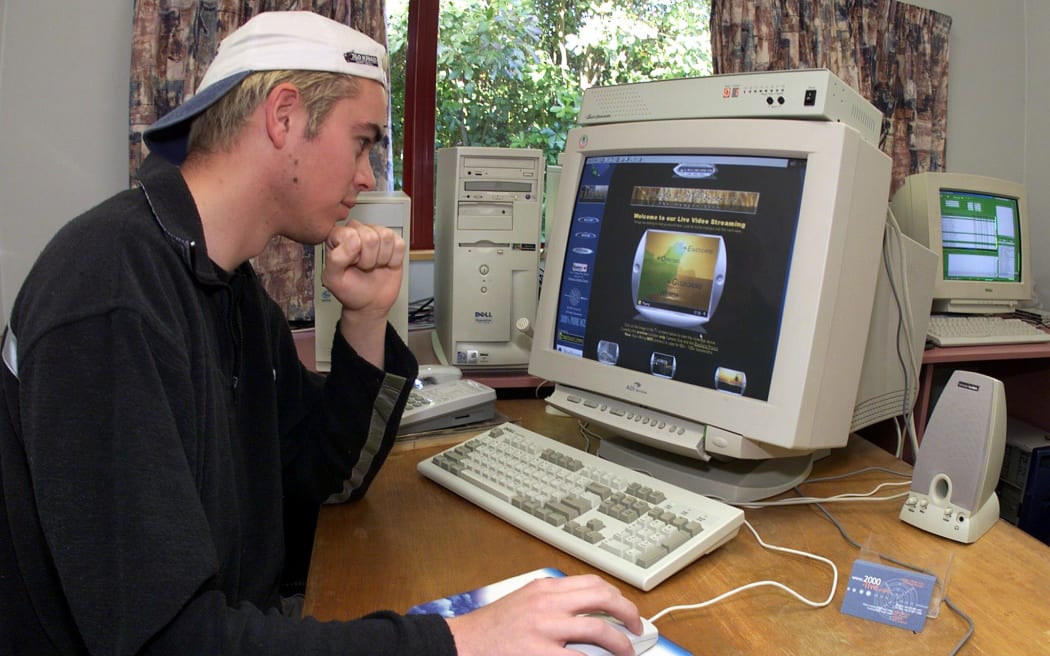 Computer technician Colin Jones puts the finishing touches to his "2000-Live" website in Gisborne 30 November 1999 which will broadcast on-line (www.2000-Live.com) the dawn of the new millennium via five remote-controlled video cameras.
