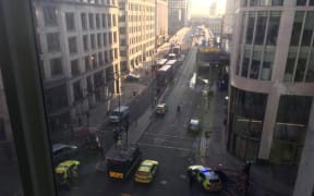 A handout picture shows members of the police and emergency services setting up a cordon on London Bridge following an incident in central London on November 29, 2019.